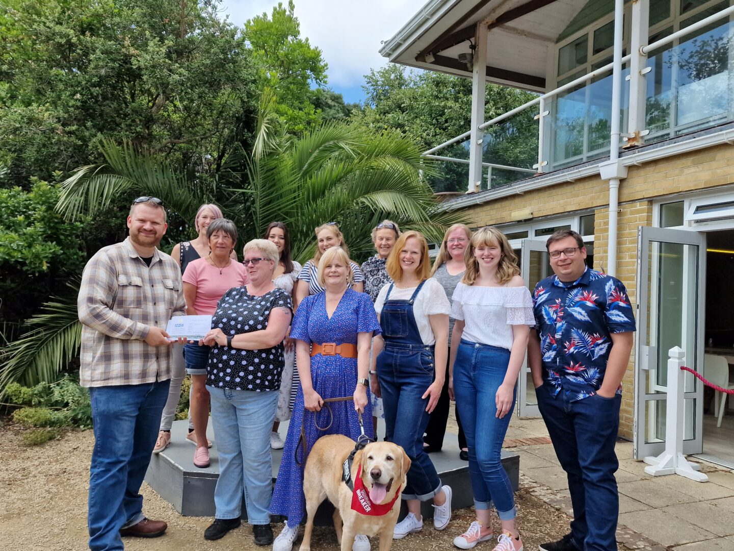 20220625_132248 Marketing manager Kai Davis presenting the first batch of recovery passes to the medical staff from St Mary's Hospital on site at Ventnor Botanic Garden